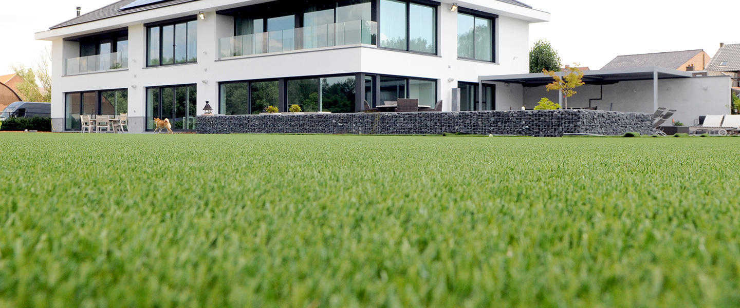 dense fake grass laid at a modern house