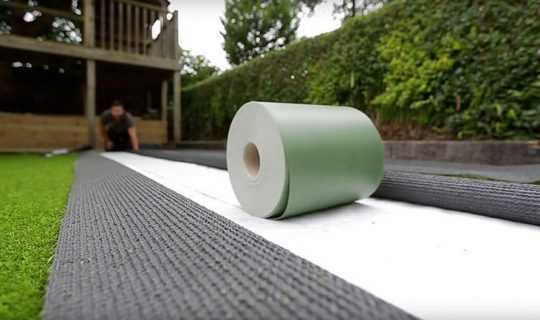 joint tape rolled out to join artificial grass