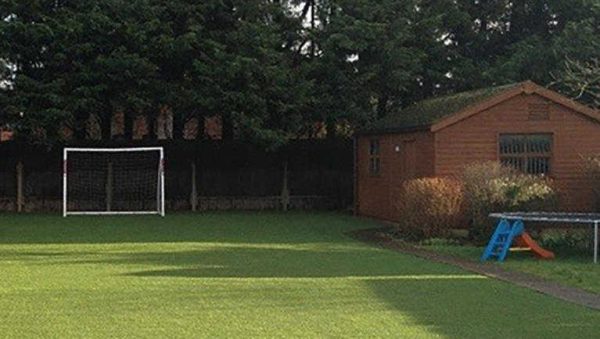 artificial grass laid in garden for children