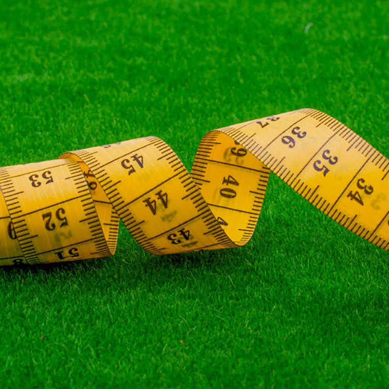 tape measure measuring artificial grass