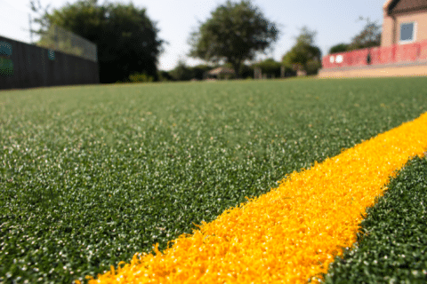 school sports pitch install with fake grass