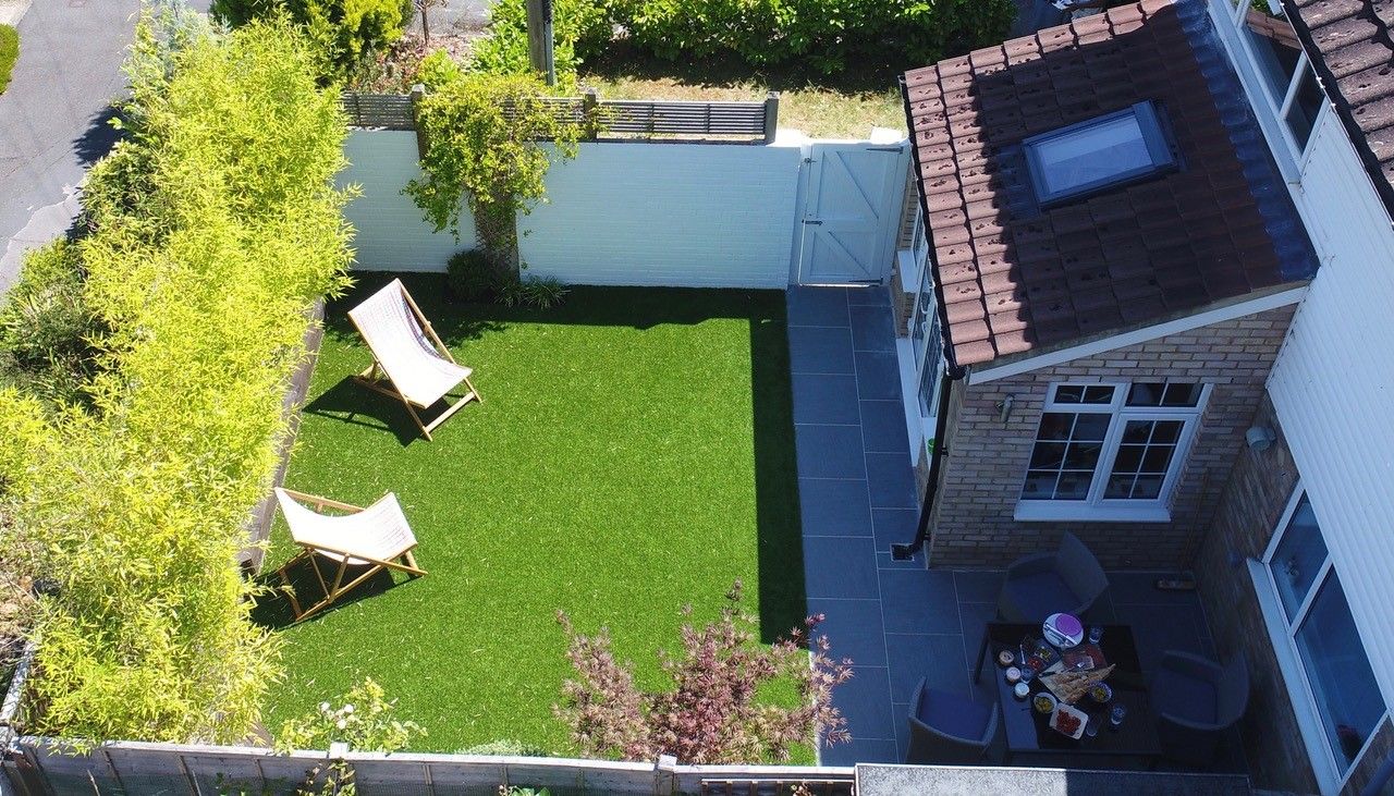 artificial grass in sunny back garden